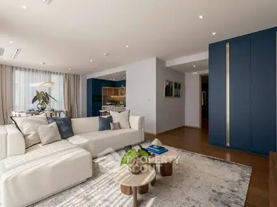 Spacious modern living room with elegant decor and open layout, perfect for relaxation and entertaining.