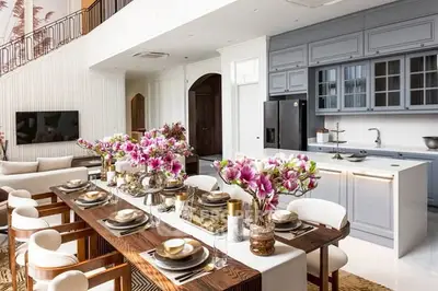 Luxurious open-plan living and dining area with elegant decor and modern kitchen.