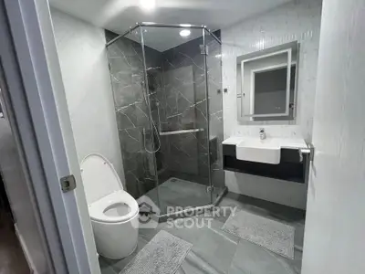 Modern bathroom with sleek glass shower and stylish fixtures