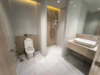 Modern bathroom with sleek fixtures and spacious shower area