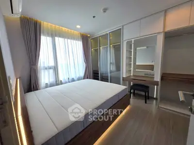 Modern bedroom with large window and built-in wardrobe, featuring elegant lighting and sleek design.