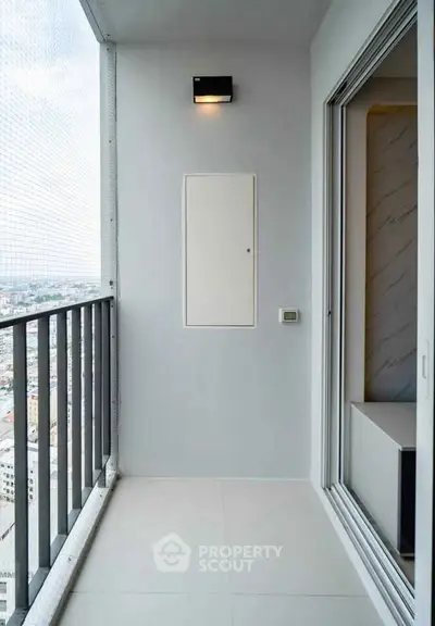 Modern high-rise balcony with city view and sleek design