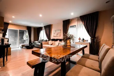 Spacious modern living room with elegant dining area and cozy seating, perfect for entertaining.