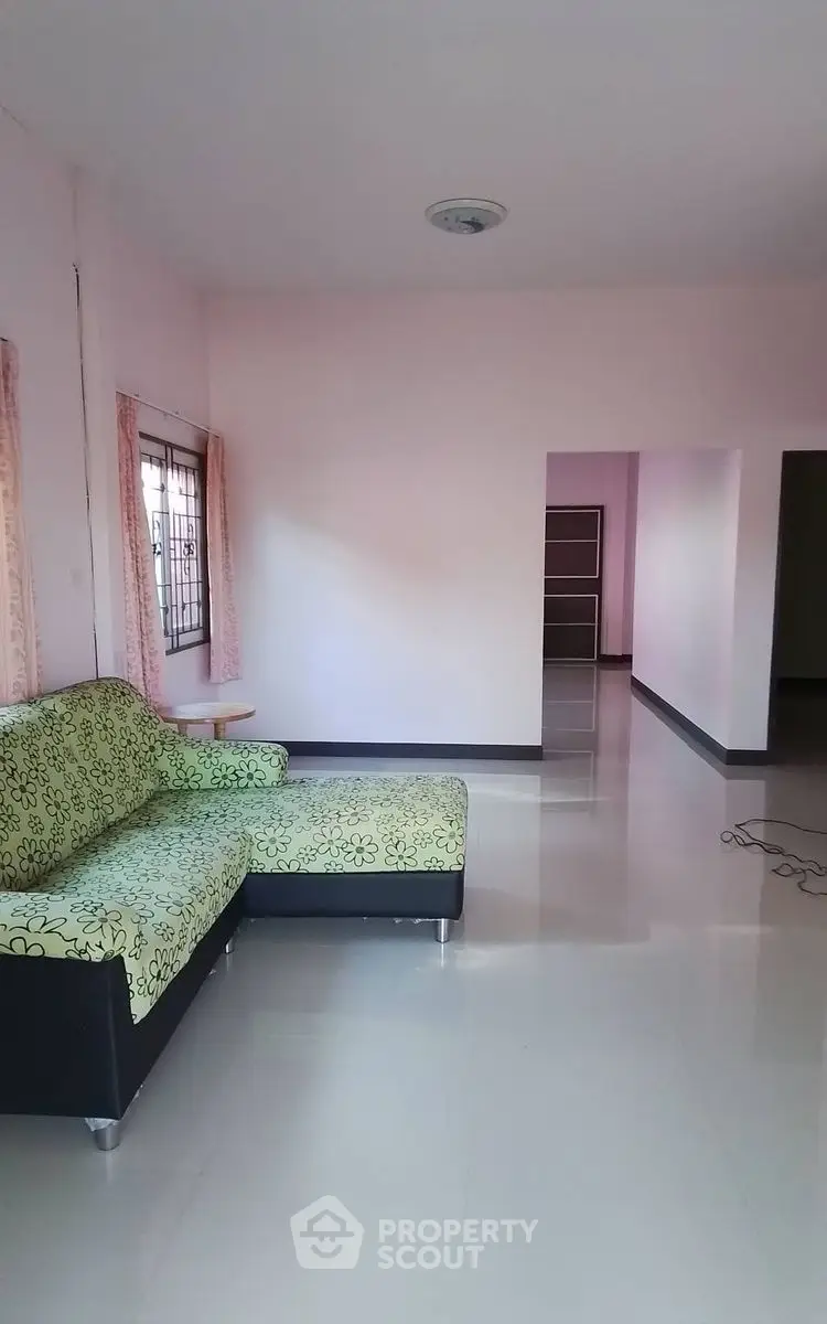 Spacious living room with modern sofa and natural light