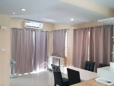 Spacious dining area with modern furnishings and ample natural light