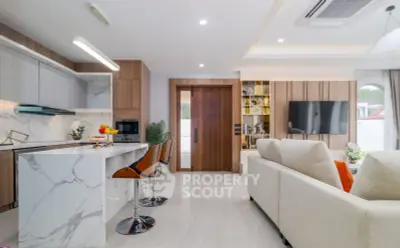 Luxurious open-plan living room with modern kitchen and stylish decor
