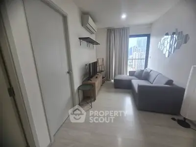 Modern living room with sleek furniture and city view, perfect for urban living.