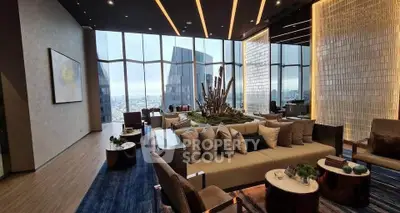 Luxurious modern living room with panoramic city views and elegant decor.