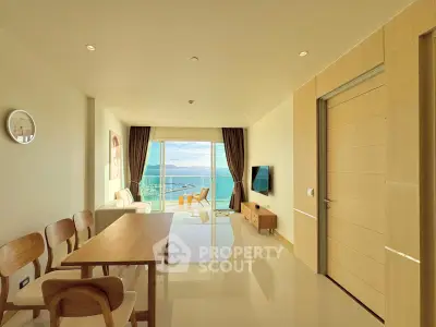 Stunning ocean-view living room with modern decor and ample natural light.