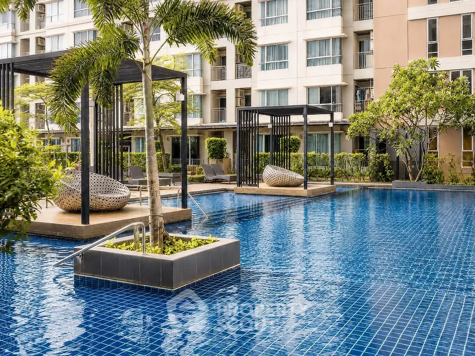 Luxurious apartment complex with stunning pool and modern cabanas