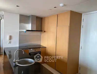 Modern kitchen with sleek cabinetry and built-in appliances