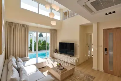 Luxurious living room with pool view, modern decor, and high ceilings in a contemporary home.