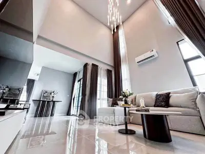 Luxurious modern living room with high ceilings and elegant decor