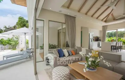 Luxurious open-plan living room with poolside view and modern kitchen