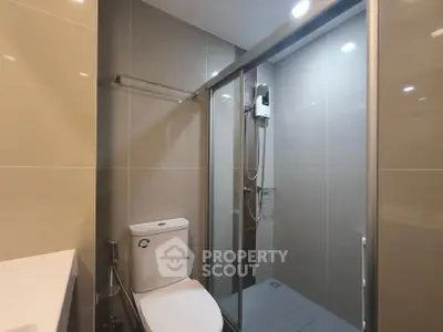 Modern bathroom with sleek shower enclosure and contemporary fixtures