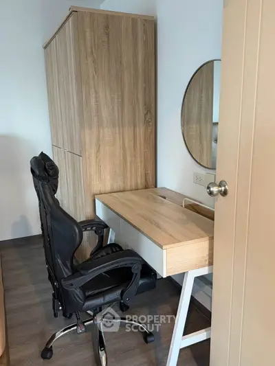 Modern study room with sleek wooden desk and ergonomic chair, perfect for productivity and comfort.