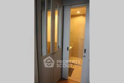 Modern bathroom with sliding doors and elegant lighting