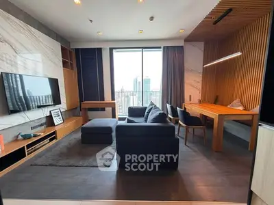 Modern living room with city view, featuring sleek furniture and wooden accents, perfect for urban living.