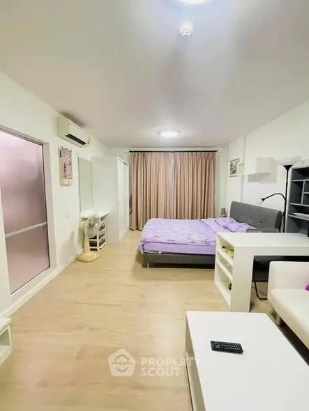 Spacious modern bedroom with stylish decor and natural light