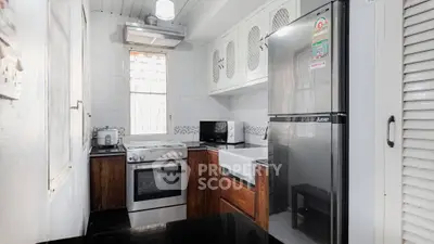 Charming kitchen with modern appliances and sleek design in cozy home