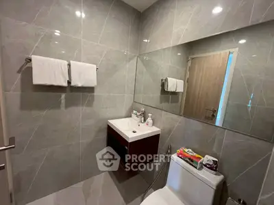 Modern bathroom with sleek tiles and contemporary fixtures