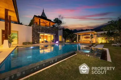 Luxurious villa with stunning pool and sunset view, perfect for serene living.