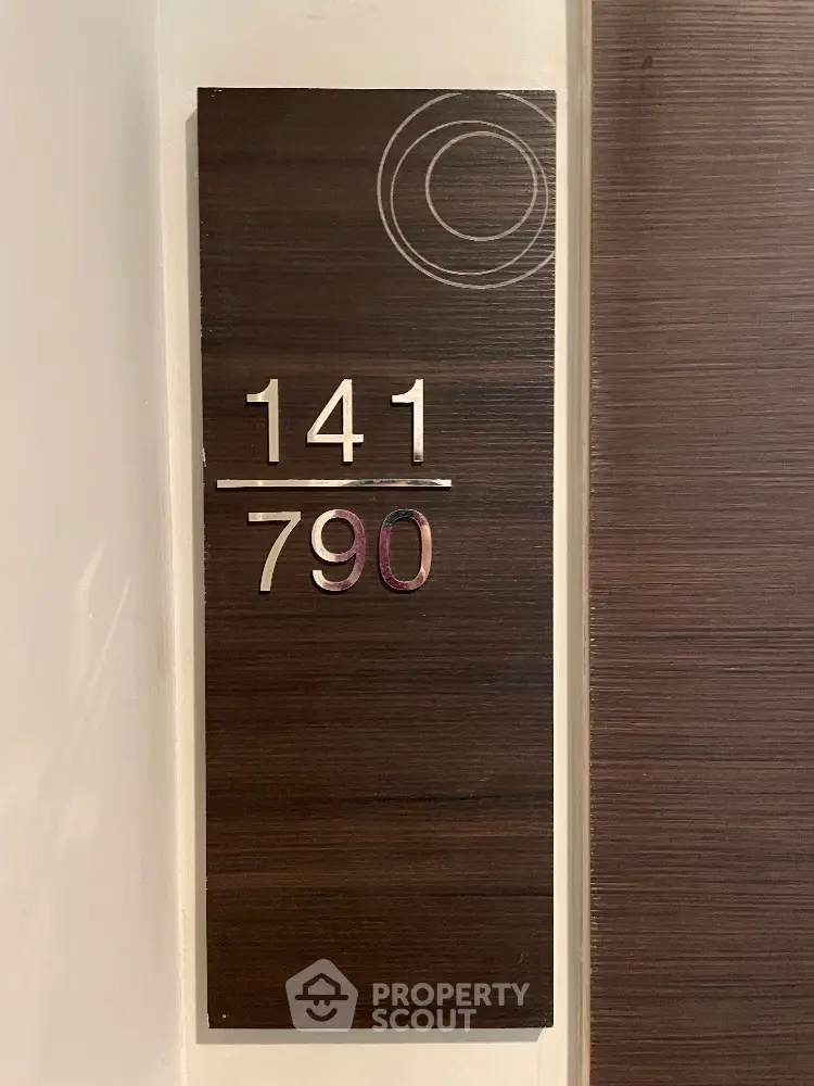 Modern apartment number plaque with stylish design, perfect for contemporary real estate listings.