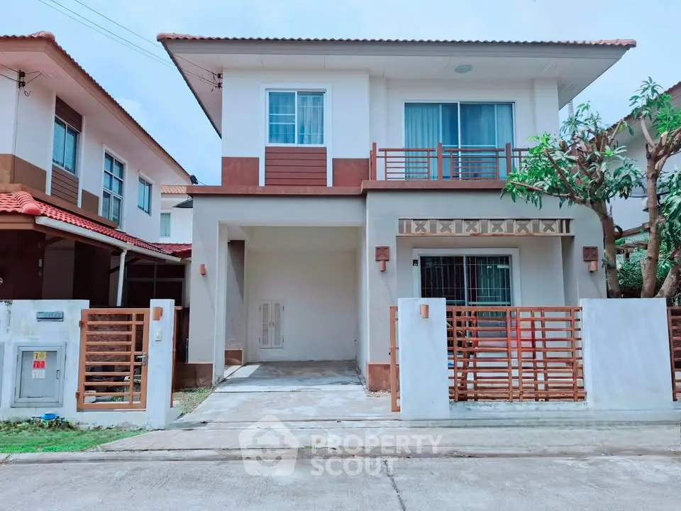 Charming two-story house with modern design and spacious driveway in a serene neighborhood.