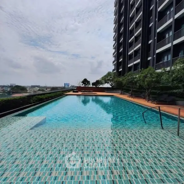 Luxurious high-rise apartment with stunning rooftop pool and city views.