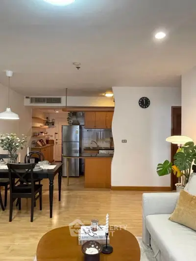 Spacious open-plan living room with modern kitchen and dining area