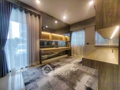 Modern living room with stylish decor and large windows for natural light.