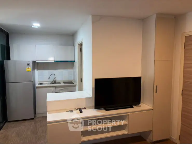 Modern living room with sleek design and large TV