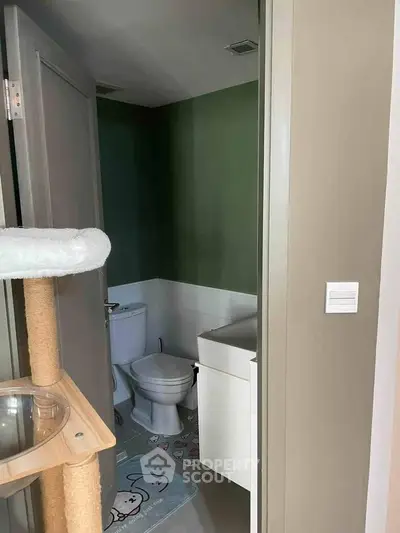 Cozy bathroom with modern fixtures and playful decor in a stylish home.