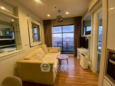 Modern living room with city view, stylish decor, and cozy seating area.