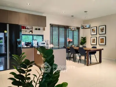 Modern kitchen with sleek design, open layout, and elegant dining area, perfect for contemporary living.