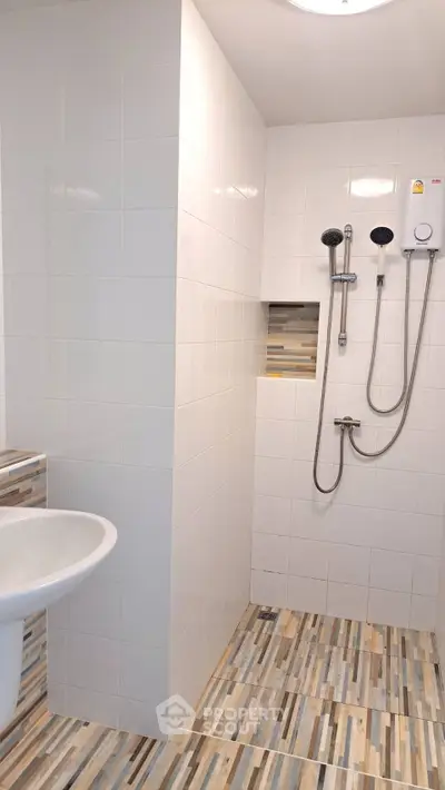 Modern bathroom with stylish shower and tiled flooring