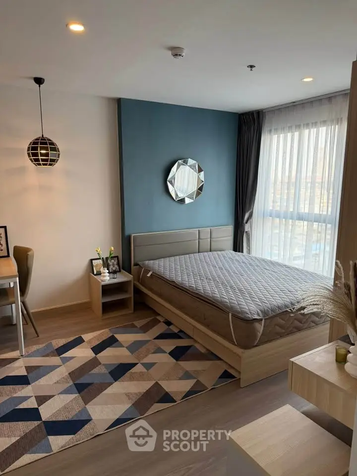 Modern bedroom with stylish decor and natural light