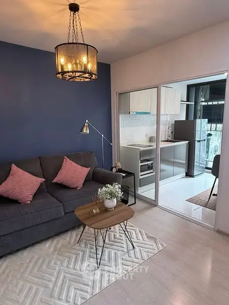 Stylish living room with modern decor and open kitchen layout