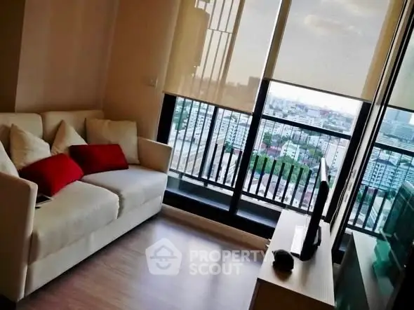 Modern living room with city view and cozy seating area