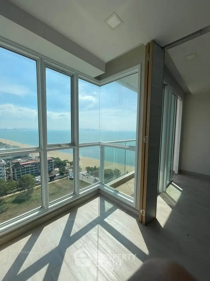 Stunning corner unit with panoramic ocean views and floor-to-ceiling windows, offering abundant natural light.