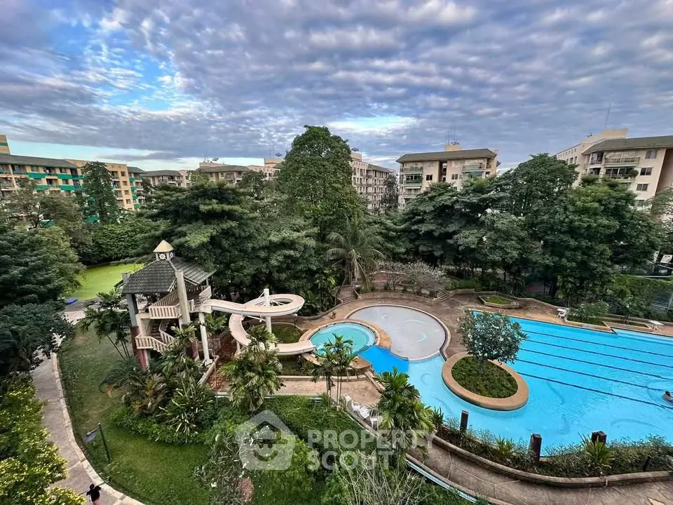 Luxurious residential complex with stunning pool and lush greenery