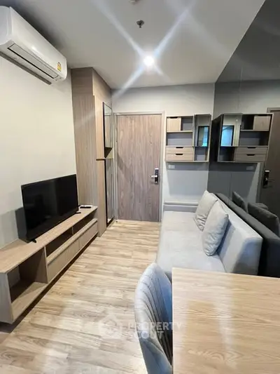 Modern living room with sleek furniture and wooden flooring