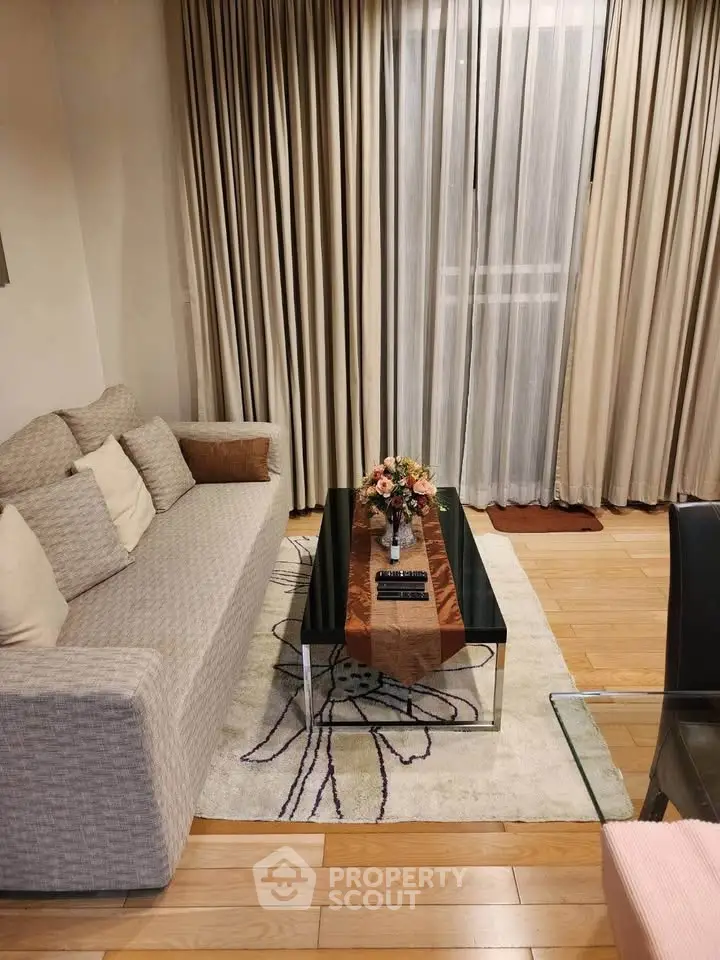 Cozy living room with elegant sofa and stylish coffee table, perfect for relaxation and entertaining.