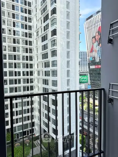 Modern urban balcony with city view in high-rise apartment building