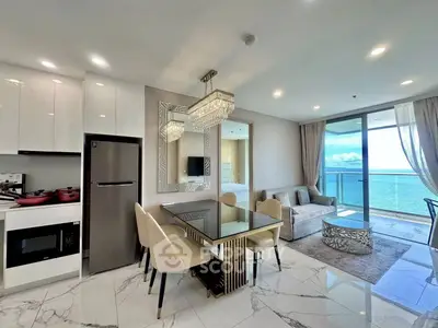 Luxurious open-plan living room with ocean view and modern kitchen