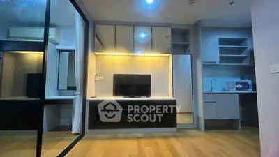 Modern living room with sleek cabinetry and built-in TV unit