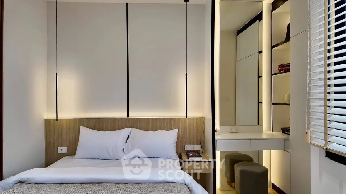 Modern bedroom with sleek design and ambient lighting, featuring a cozy bed and stylish built-in shelves.