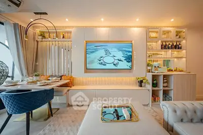 Luxurious modern living room with elegant decor and built-in entertainment center.