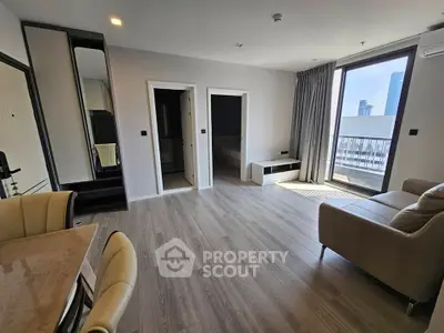 Modern living room with sleek design and city view balcony
