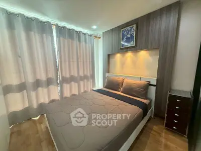 Cozy bedroom with modern decor and soft lighting, featuring a comfortable bed and stylish curtains.